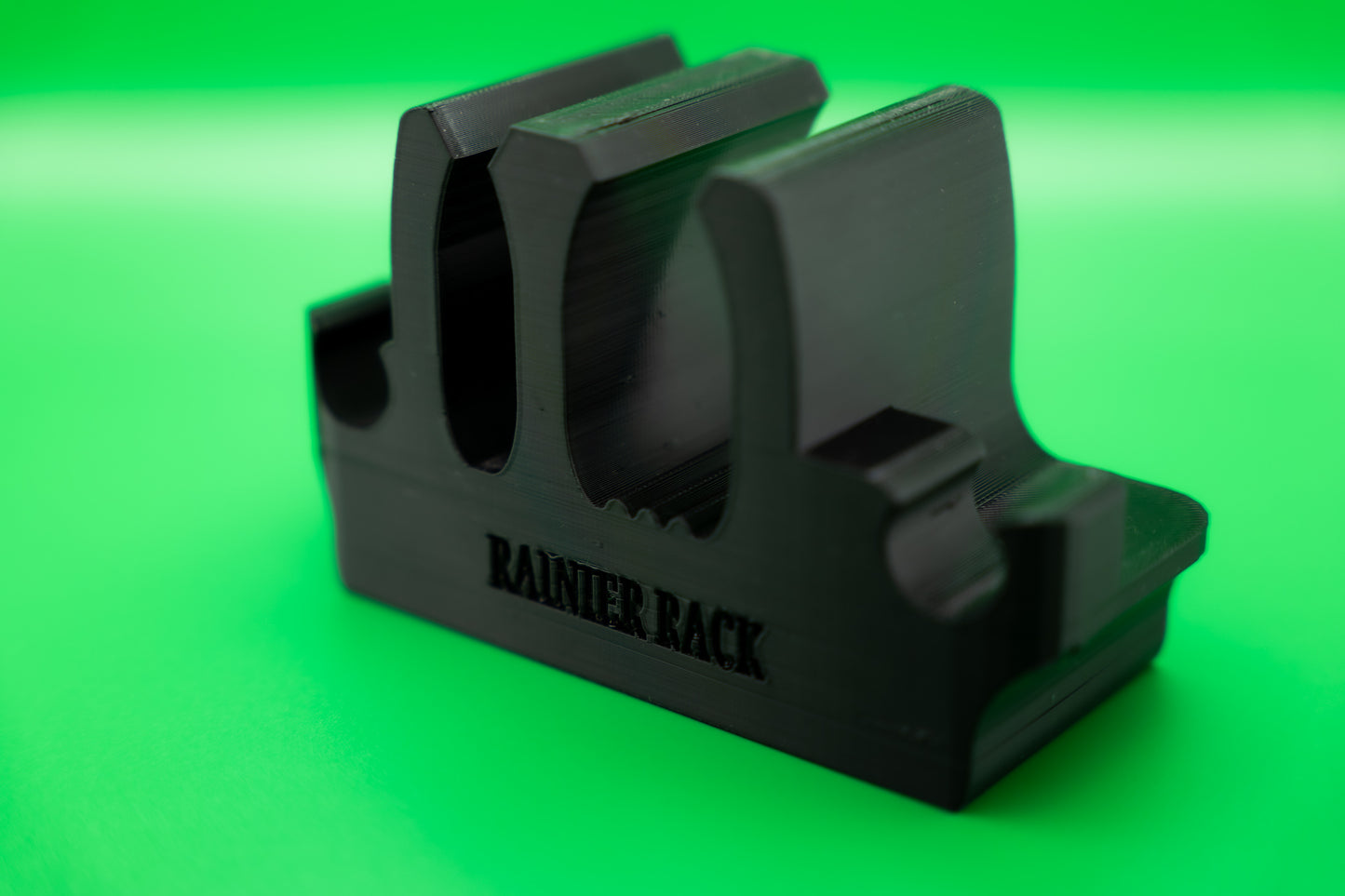 Black ski rack on green background